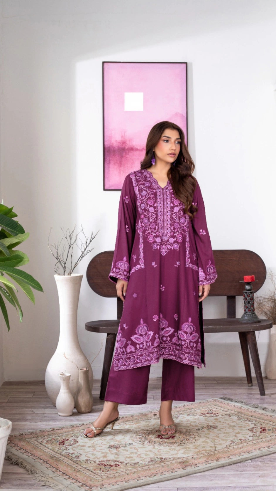Stylish plum Pakistani attire displayed in a sophisticated home setting