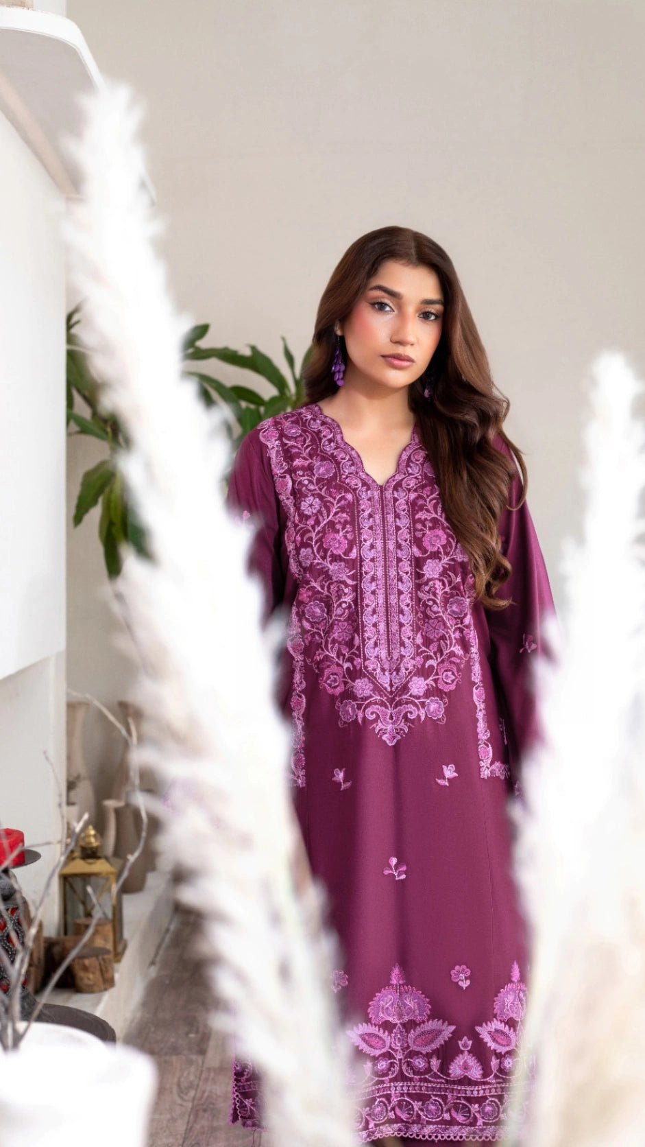 Beautiful plum embroidered outfit with a flowing dupatta and elegant design