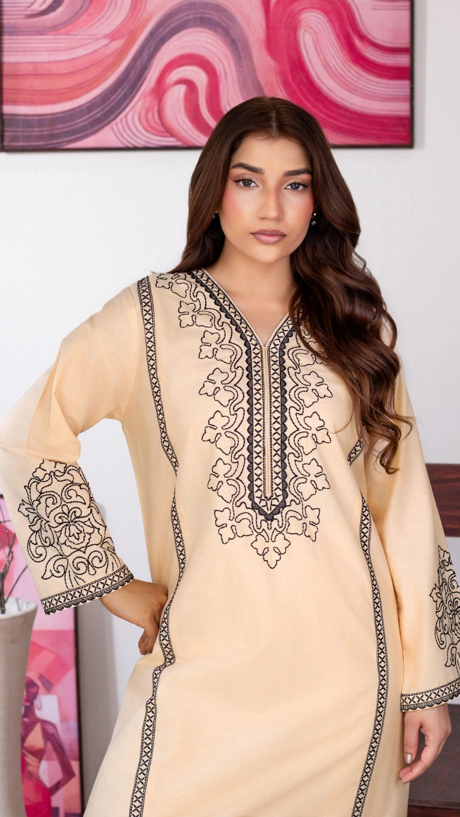 Traditional lime Pakistani outfit with detailed embroidery